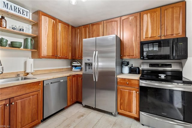 55 Brogden Ln, Hampton, VA 23666 - kitchen with appliances with stainless steel finishes, light countertops, and brown cabinetry