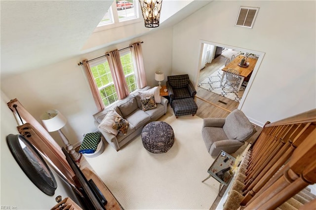 55 Brogden Ln, Hampton, VA 23666 - living room featuring vaulted ceiling, wood finished floors, and a chandelier