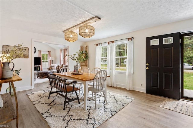 55 Brogden Ln, Hampton, VA 23666 - dining space featuring a textured ceiling, wood finished floors, and a chandelier