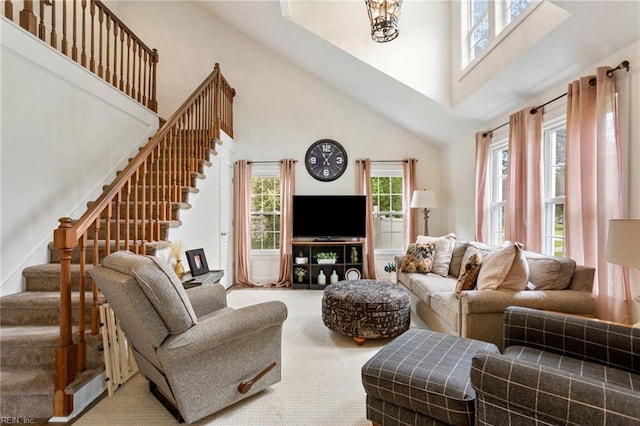55 Brogden Ln, Hampton, VA 23666 - carpeted living room with a towering ceiling, stairs, and plenty of natural light