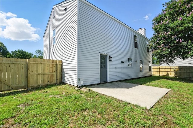 39 Rotherham Ln, Hampton, VA 23666 - back of house with a fenced backyard, a patio, and a chimney