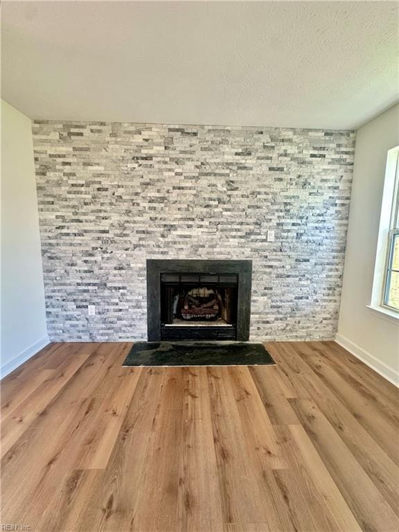 39 Rotherham Ln, Hampton, VA 23666 - detailed view of wood finished floors and a fireplace with flush hearth