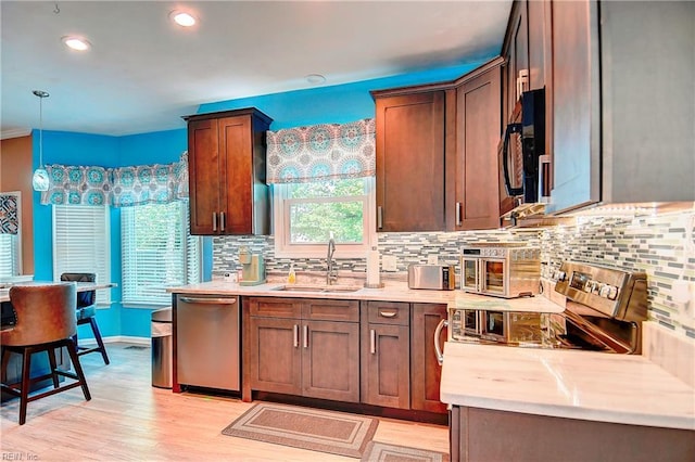 832 Doe Run Dr, Chesapeake, VA 23322 - kitchen featuring dishwasher, black microwave, tasteful backsplash, light wood-style flooring, and recessed lighting