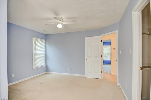 832 Doe Run Dr, Chesapeake, VA 23322 - unfurnished bedroom featuring light carpet, multiple windows, and a ceiling fan