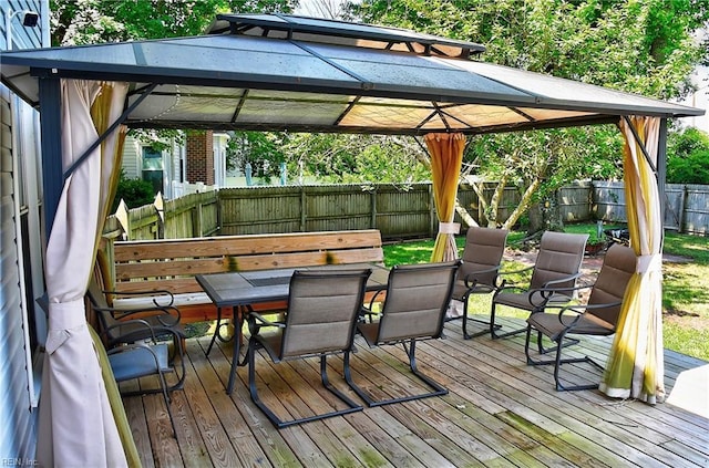 832 Doe Run Dr, Chesapeake, VA 23322 - wooden deck with outdoor dining space, a gazebo, and a fenced backyard