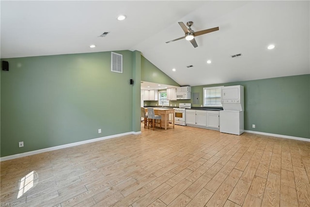 9001 Tidewater Dr, Norfolk, VA 23503 - unfurnished living room featuring ceiling fan, light wood-style flooring, and lofted ceiling
