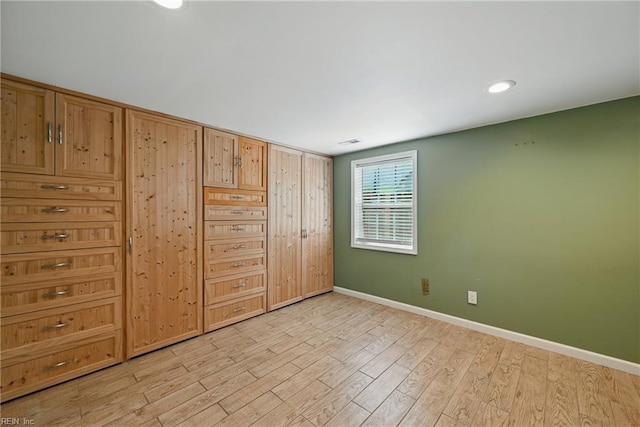 9001 Tidewater Dr, Norfolk, VA 23503 - unfurnished bedroom featuring light wood finished floors and baseboards
