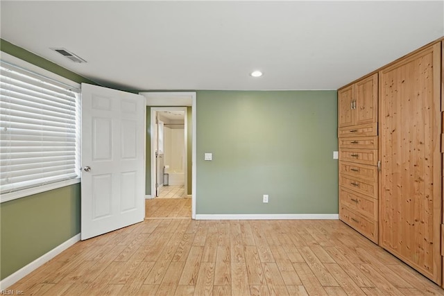9001 Tidewater Dr, Norfolk, VA 23503 - unfurnished bedroom featuring light wood-style flooring and recessed lighting