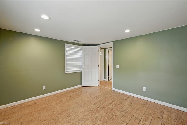 9001 Tidewater Dr, Norfolk, VA 23503 - empty room with recessed lighting and light wood-style flooring