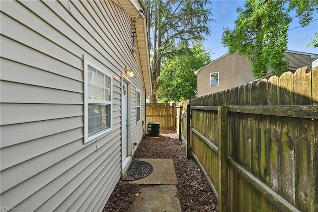 9001 Tidewater Dr, Norfolk, VA 23503 - view of side of property featuring a fenced backyard and a central AC unit
