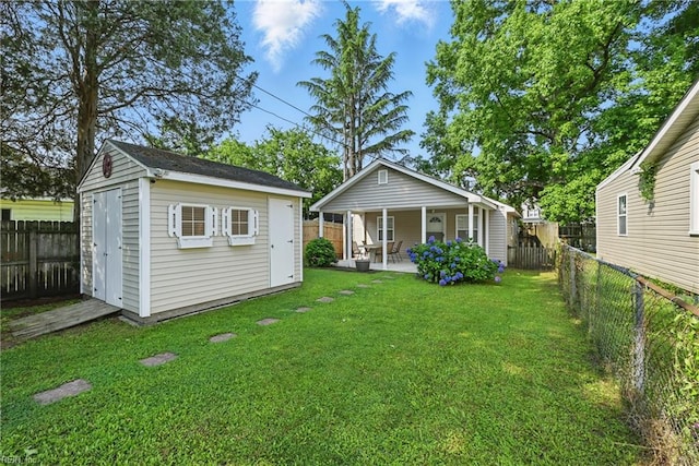 9001 Tidewater Dr, Norfolk, VA 23503 - back of property featuring a fenced backyard, a storage unit, and a patio area