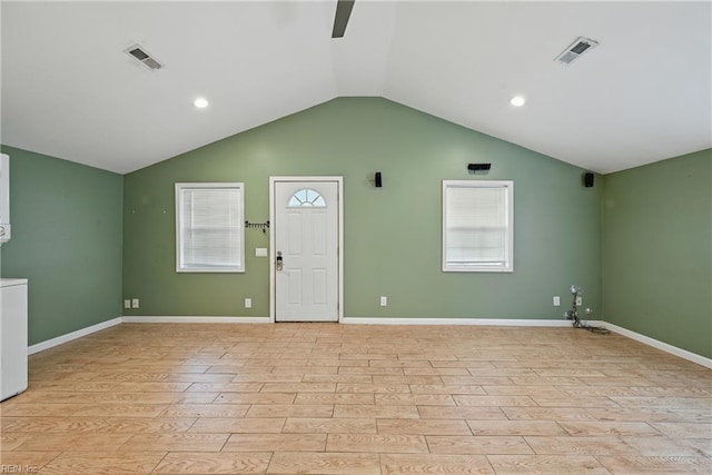 9001 Tidewater Dr, Norfolk, VA 23503 - spare room featuring light wood finished floors, lofted ceiling, plenty of natural light, washer / dryer, and ceiling fan