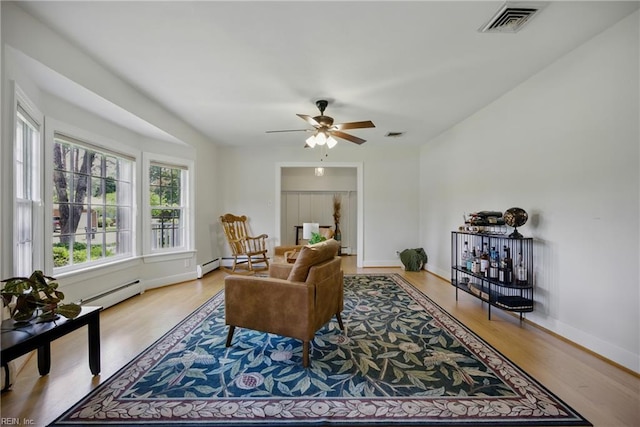 2400 Deerfield Cres, Chesapeake, VA 23321 - living room with baseboard heating, wood finished floors, and ceiling fan