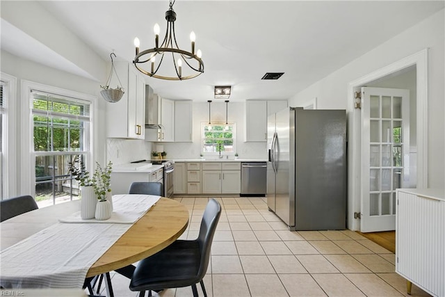 2400 Deerfield Cres, Chesapeake, VA 23321 - kitchen featuring stainless steel appliances, healthy amount of natural light, a chandelier, and light countertops