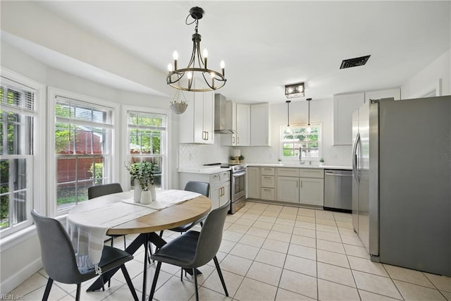2400 Deerfield Cres, Chesapeake, VA 23321 - dining area featuring plenty of natural light, a chandelier, and light tile patterned floors