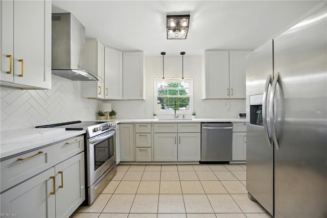 2400 Deerfield Cres, Chesapeake, VA 23321 - kitchen featuring appliances with stainless steel finishes, wall chimney exhaust hood, backsplash, light tile patterned floors, and light stone countertops