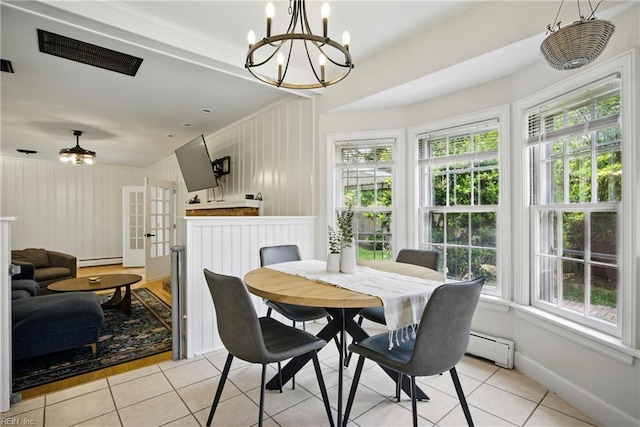 2400 Deerfield Cres, Chesapeake, VA 23321 - dining room featuring light tile patterned floors, a baseboard radiator, a chandelier, and a baseboard heating unit