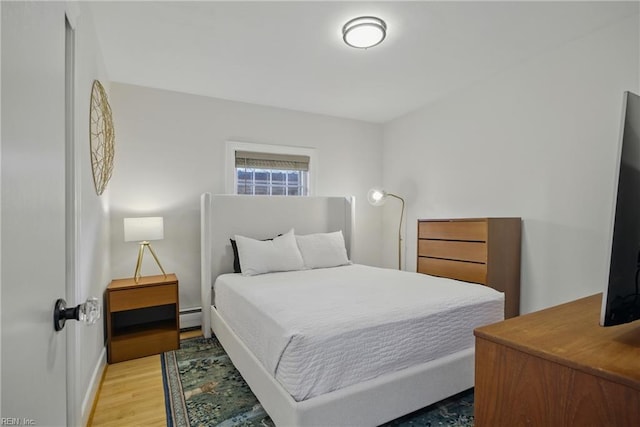 2400 Deerfield Cres, Chesapeake, VA 23321 - bedroom featuring a baseboard heating unit and light wood finished floors