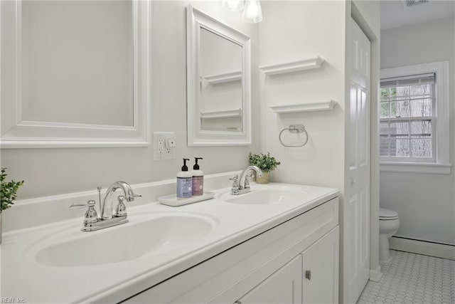 2400 Deerfield Cres, Chesapeake, VA 23321 - bathroom with double vanity, baseboard heating, and tile patterned flooring
