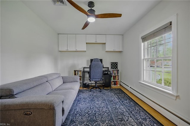 2400 Deerfield Cres, Chesapeake, VA 23321 - office featuring a baseboard heating unit, plenty of natural light, ceiling fan, and wood finished floors