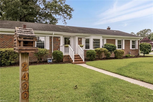 2400 Deerfield Cres, Chesapeake, VA 23321 - ranch-style house with brick siding, a front lawn, and a chimney