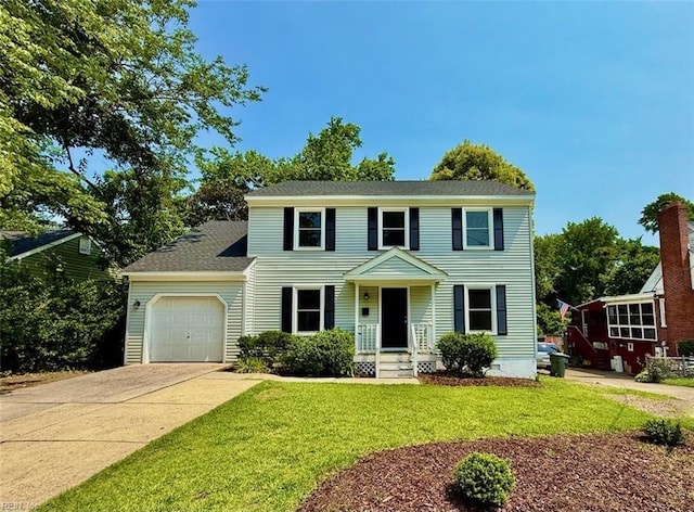 1046 Ivaloo St, Norfolk, VA 23513 - colonial home featuring a garage, concrete driveway, and a front lawn