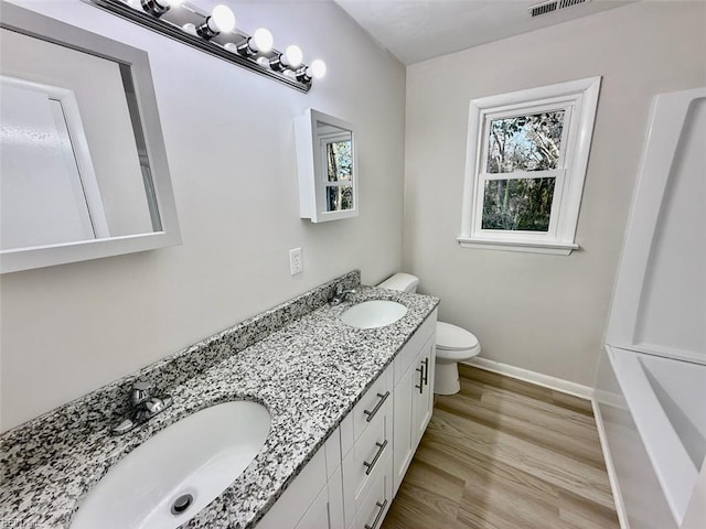 1046 Ivaloo St, Norfolk, VA 23513 - bathroom with double vanity, wood finished floors, and a bath