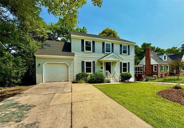 1046 Ivaloo St, Norfolk, VA 23513 - colonial house with a garage, driveway, and a front lawn