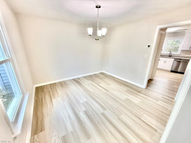 1046 Ivaloo St, Norfolk, VA 23513 - spare room with a chandelier and light wood-style floors