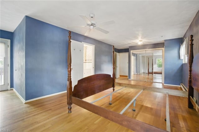 709 Wolfsnare Cres, Virginia Beach, VA 23454 - bedroom featuring wood finished floors, multiple windows, a baseboard radiator, and ceiling fan