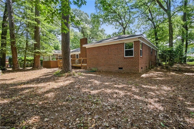 709 Wolfsnare Cres, Virginia Beach, VA 23454 - view of side of home featuring crawl space, a deck, a chimney, and brick siding
