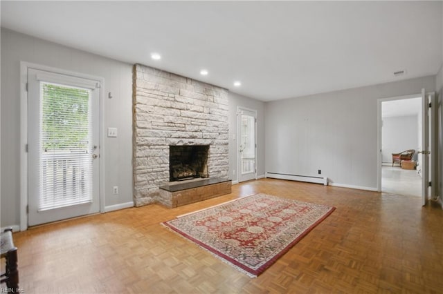 709 Wolfsnare Cres, Virginia Beach, VA 23454 - unfurnished living room with baseboard heating, a stone fireplace, and recessed lighting