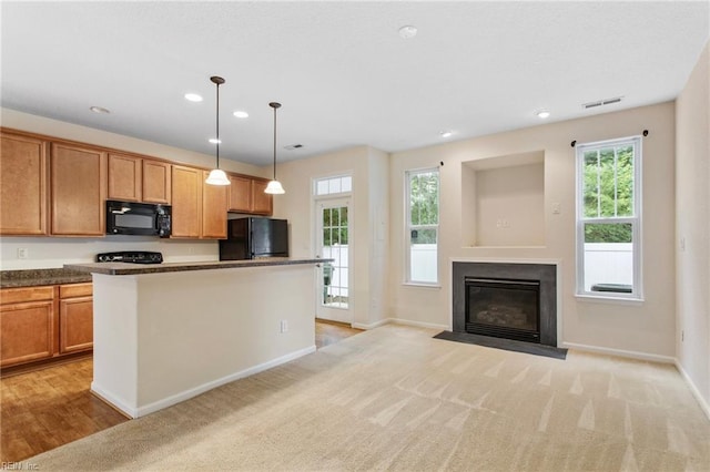 2741 Deep Creek Cmn, Chesapeake, VA 23323 - kitchen featuring black appliances, recessed lighting, pendant lighting, a fireplace with flush hearth, and a kitchen island