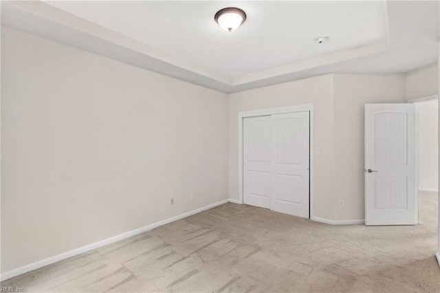 2741 Deep Creek Cmn, Chesapeake, VA 23323 - unfurnished bedroom with carpet, a closet, and a raised ceiling