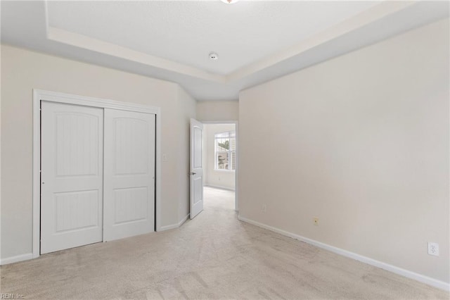 2741 Deep Creek Cmn, Chesapeake, VA 23323 - unfurnished bedroom featuring carpet, a closet, and a raised ceiling