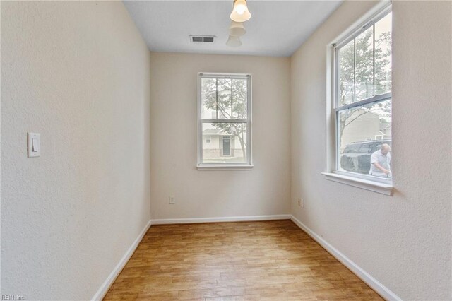 2741 Deep Creek Cmn, Chesapeake, VA 23323 - spare room with light wood-style floors and a textured wall