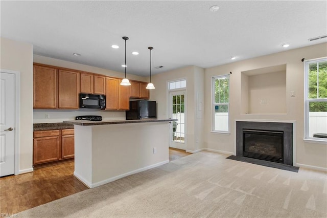 2741 Deep Creek Cmn, Chesapeake, VA 23323 - kitchen with black appliances, recessed lighting, pendant lighting, brown cabinets, and dark countertops
