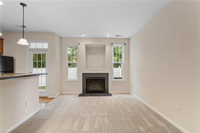 2741 Deep Creek Cmn, Chesapeake, VA 23323 - unfurnished living room with light carpet and a fireplace with flush hearth