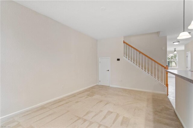 2741 Deep Creek Cmn, Chesapeake, VA 23323 - unfurnished living room with stairway and light colored carpet