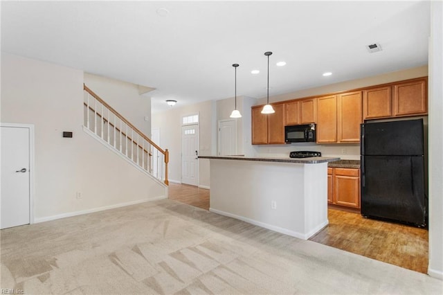 2741 Deep Creek Cmn, Chesapeake, VA 23323 - kitchen featuring black appliances, light colored carpet, hanging light fixtures, recessed lighting, and brown cabinetry