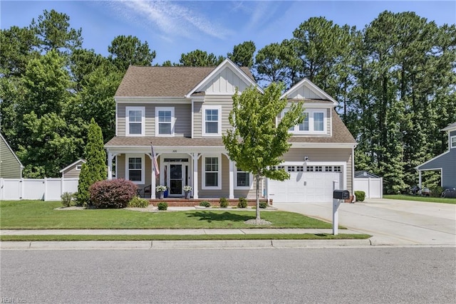 220 Wisdom Path, Chesapeake, VA 23322 - view of front of home featuring concrete driveway, a garage, board and batten siding, and a porch