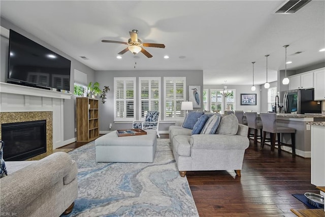 220 Wisdom Path, Chesapeake, VA 23322 - living room featuring a ceiling fan, recessed lighting, dark wood-type flooring, and a fireplace