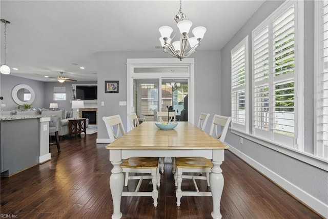220 Wisdom Path, Chesapeake, VA 23322 - dining area with a fireplace, dark wood finished floors, a chandelier, recessed lighting, and ceiling fan