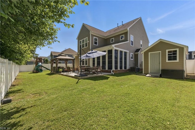 220 Wisdom Path, Chesapeake, VA 23322 - rear view of house featuring a gazebo, a patio, a storage shed, a fenced backyard, and a playground