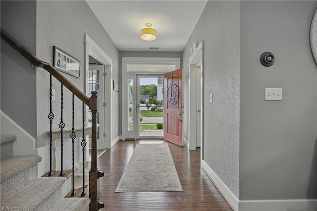 220 Wisdom Path, Chesapeake, VA 23322 - foyer featuring a textured wall, stairs, and dark wood-style flooring