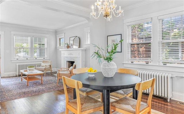 418 Massachusetts Ave, Norfolk, VA 23508 - dining room with radiator, plenty of natural light, ornamental molding, and wood finished floors