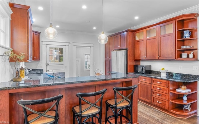 418 Massachusetts Ave, Norfolk, VA 23508 - kitchen with open shelves, freestanding refrigerator, crown molding, a peninsula, and dark stone countertops