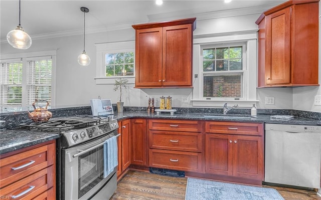 418 Massachusetts Ave, Norfolk, VA 23508 - kitchen featuring stainless steel appliances, dark wood finished floors, ornamental molding, dark stone counters, and hanging light fixtures