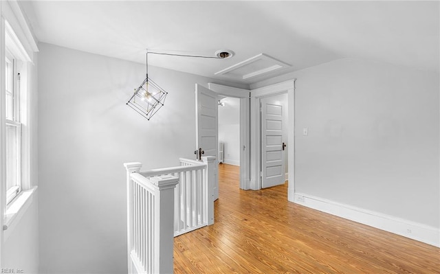 418 Massachusetts Ave, Norfolk, VA 23508 - corridor featuring an upstairs landing, light wood-style floors, vaulted ceiling, radiator, and attic access
