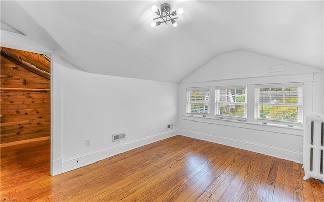 418 Massachusetts Ave, Norfolk, VA 23508 - bonus room featuring vaulted ceiling, wood-type flooring, radiator, and a chandelier